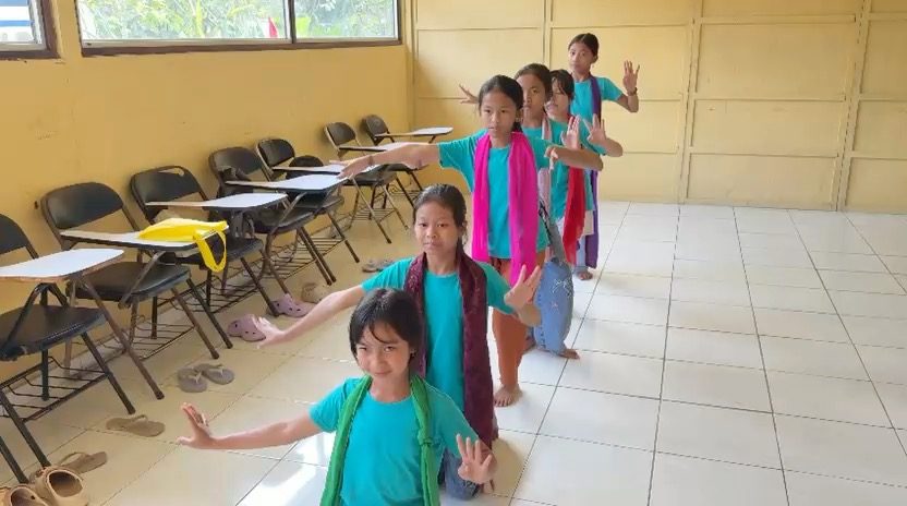 Students learning traditional Balinese dance after school