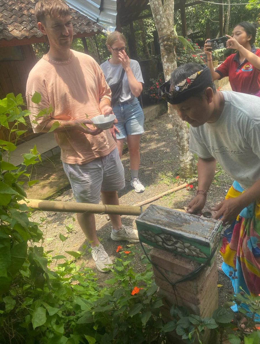Tourists tasting native stingless-bee honey straight from the hive