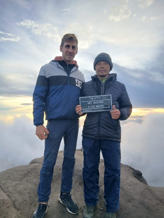 Two hikers at the summit of Mt Agung, Bali